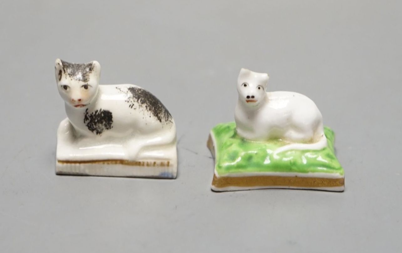A rare Chamberlain Worcester model of a recumbent kitten, c.1820–40 and a Staffordshire porcelain model of a recumbent kitten, c.1830–50 (2). Cf. Dennis G Rice, Cats in English porcelain, colour plate 29 for the same Cha
